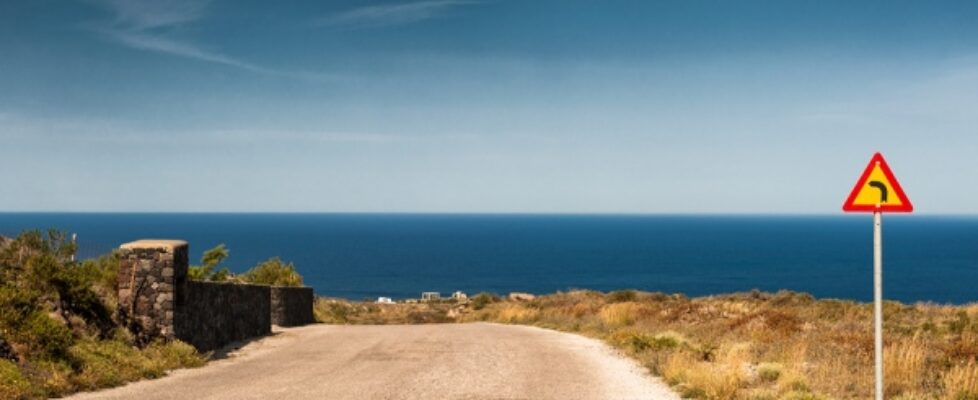 Beautiful road to the seacoast. Santorini island Greece. Summer sea landscape