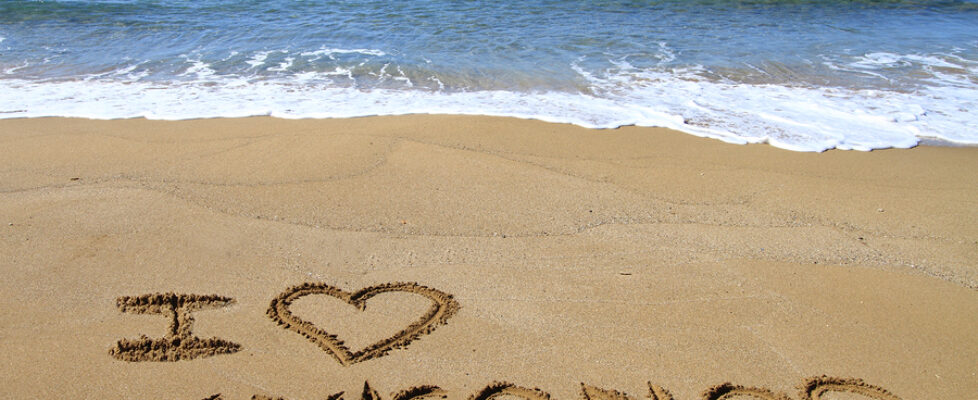 I Love Mykonos written on sandy beach